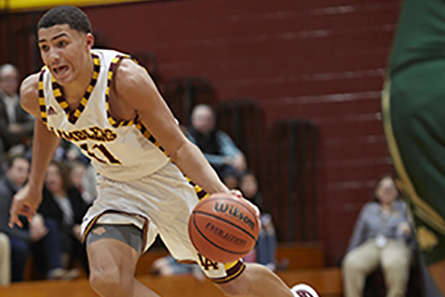 Ramblers player 11 runs with ball down court.