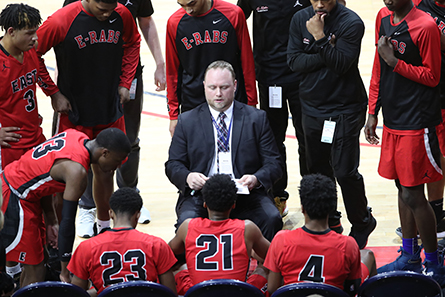 E-Rabs team huddles around coach.