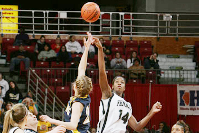 Two players jump at tip-off.